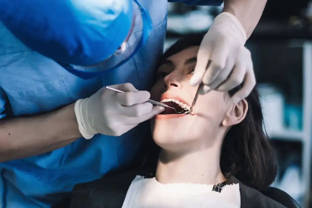 Dr. Lok performing professional teeth cleaning